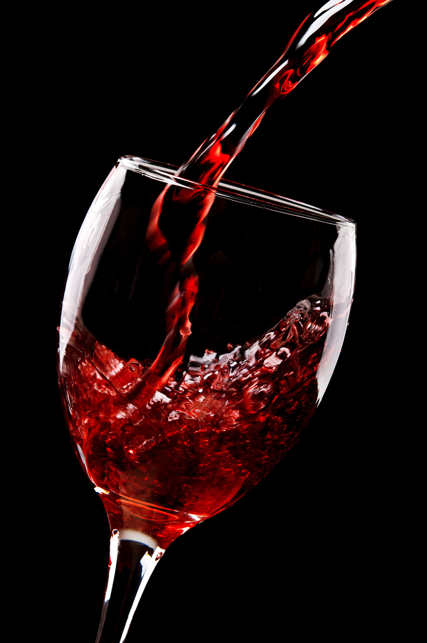 red wine pouring into glass